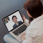 Woman has video call with strategic practice solution officer about free webinar - PPO Negotiation and Optimization - Top Dental PPO Negotiator